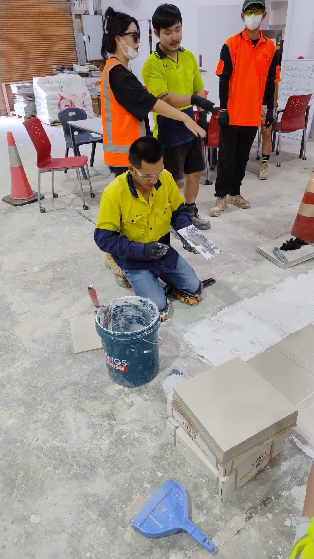 Tiling students in the workshop